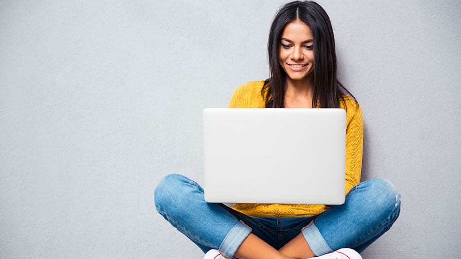 girl sitting in front of laptop