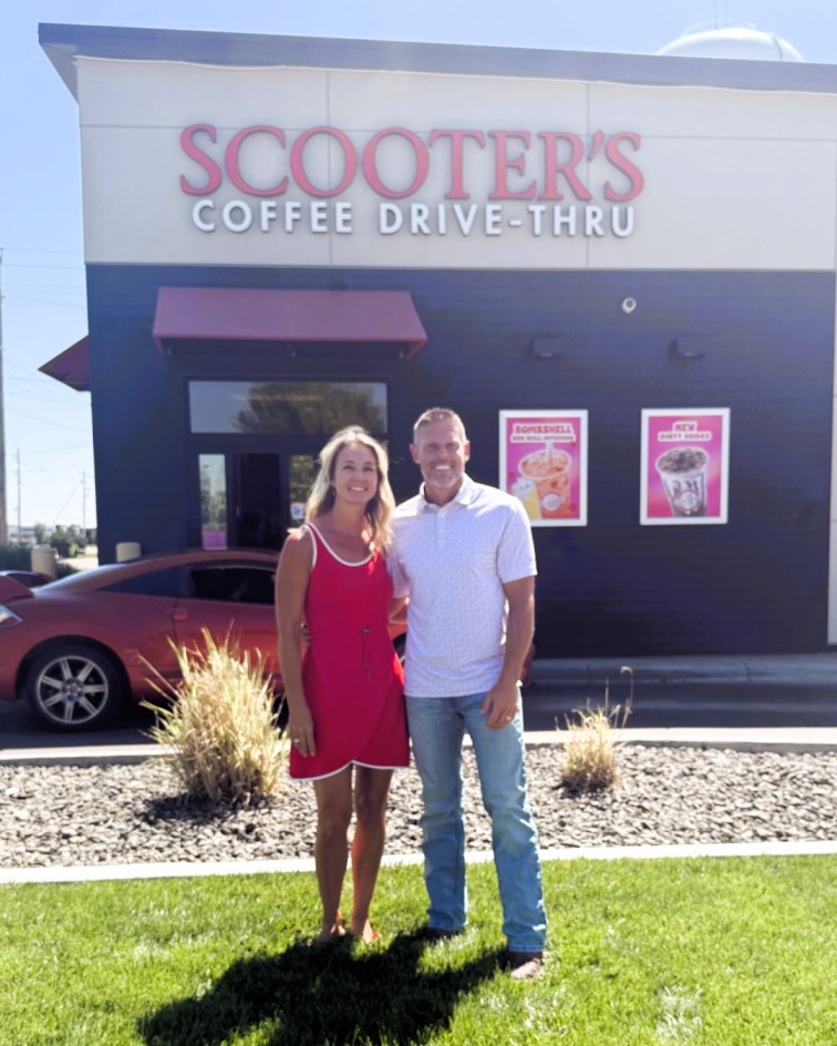 Lindsay and Donny Huber of Higher Grounds, LLC outside a Scooter’s Coffee drive-thru in Garden City, a partner in the GCCC Endowment Association’s Sip N Support scholarship initiative.