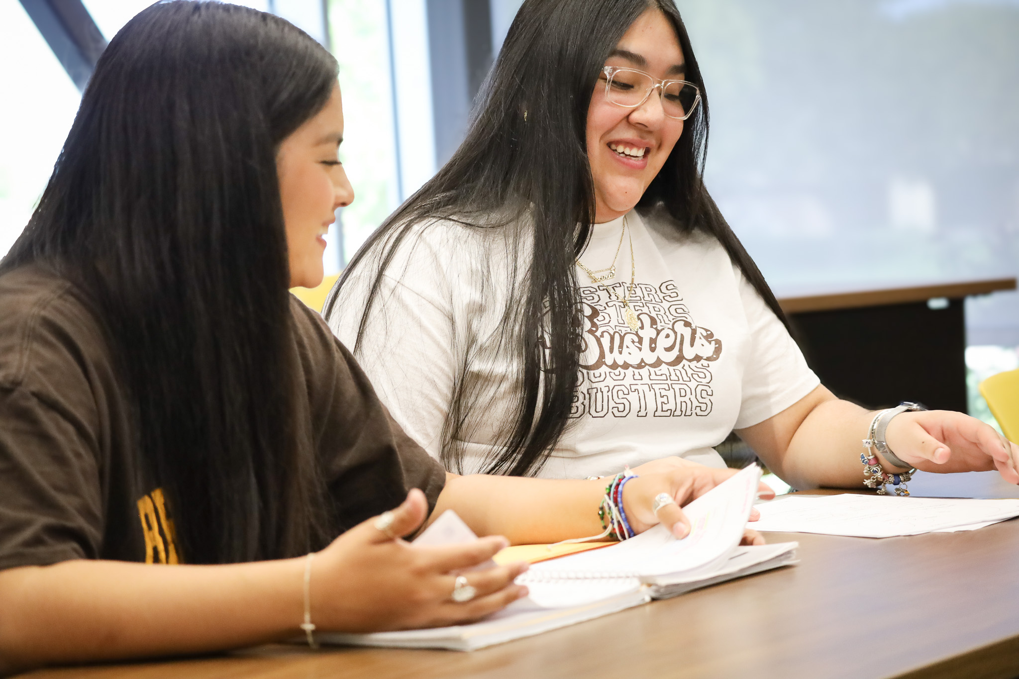 two students working at desk.
