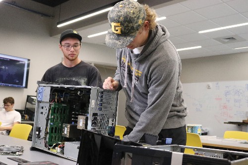 student working on a pc in class.