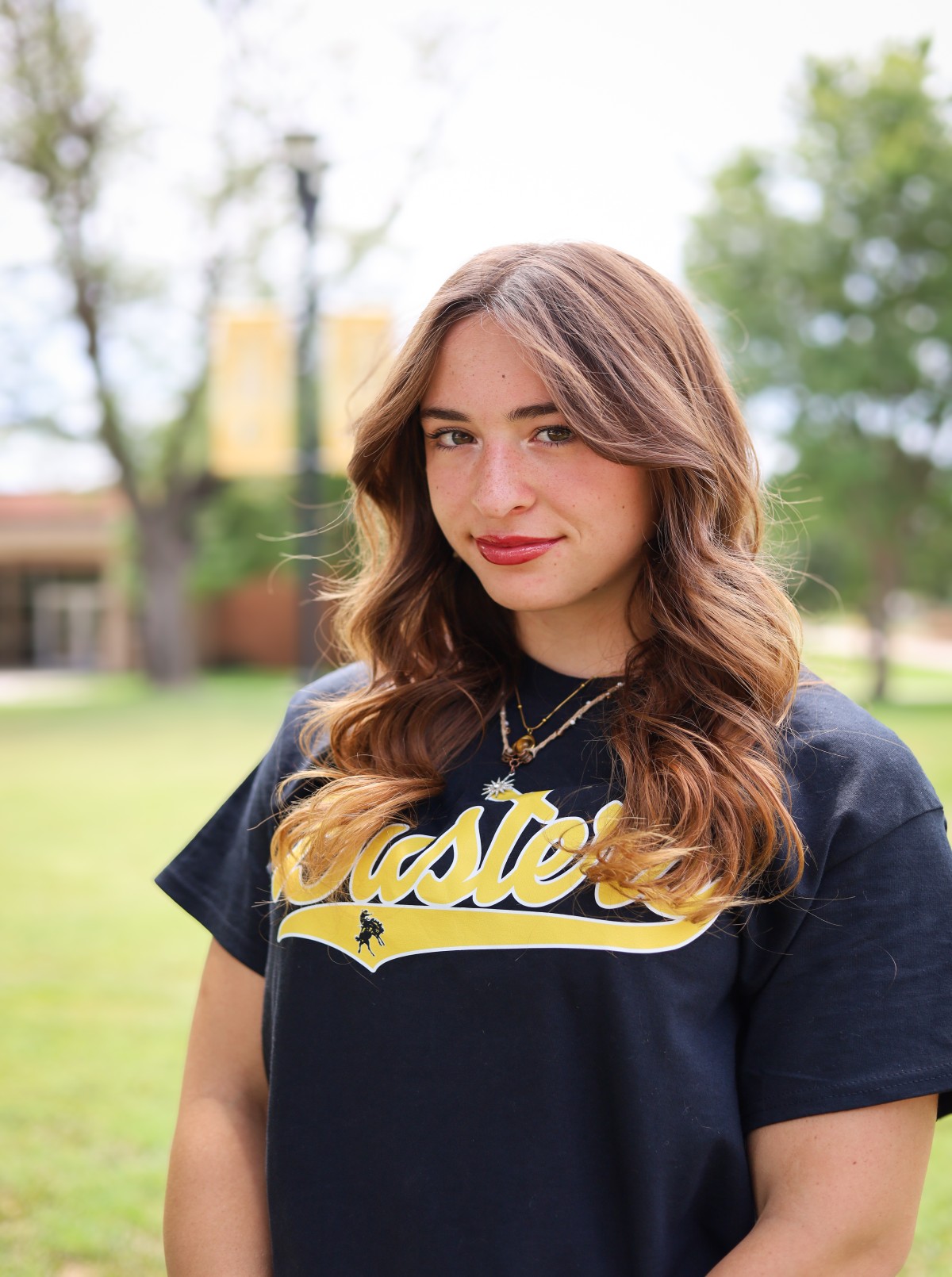 sga student in front of campus